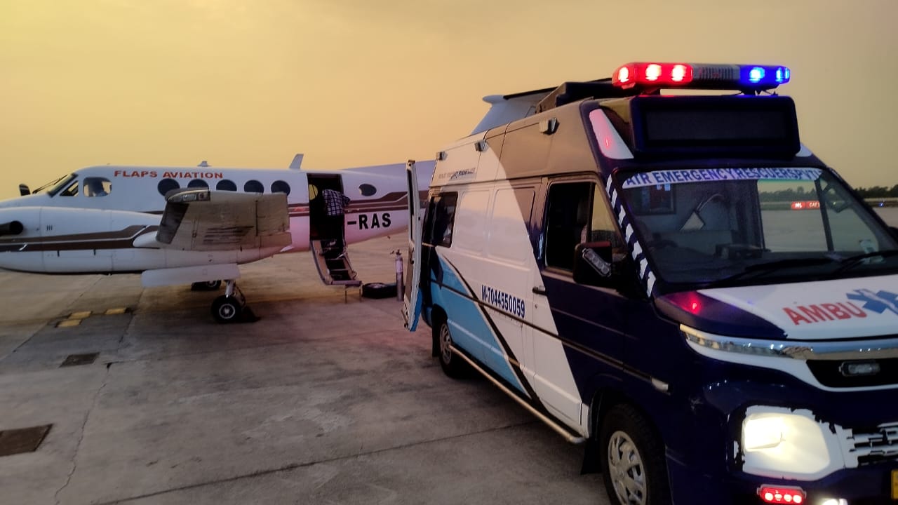 Air ambulance aircraft with medical crew on tarmac for emergency evacuation